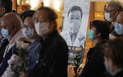 In this Feb. 7, 2020 file photo, people wearing masks attend a vigil for Chinese doctor Li Wenliang, in Hong Kong. The outpouring of grief and rage sparked by Li's death was an unusual - and for the Chinese Communist Party, unsettling - display in China's tightly monitored civic space. (AP Photo/Kin Cheung, File) In this Feb. 7, 2020 file photo, people wearing masks attend a vigil for Chinese doctor Li Wenliang, in Hong Kong. The outpouring of grief and rage sparked by Li's death was an unusual - and for the Chinese Communist Party, unsettling - display in China's tightly monitored civic space. (AP Photo/Kin Cheung, File)