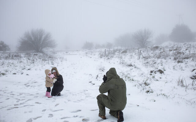 Snow-dusted Jerusalem braces for further downfall on coldest night of ...