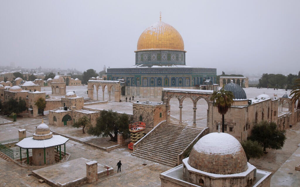 Snow dusts the Dome of the Rock atop the Temple Mount in the Old City of Jerusalem, Thursday, Feb. 18, 2021. (AP Photo/Oded Balilty)