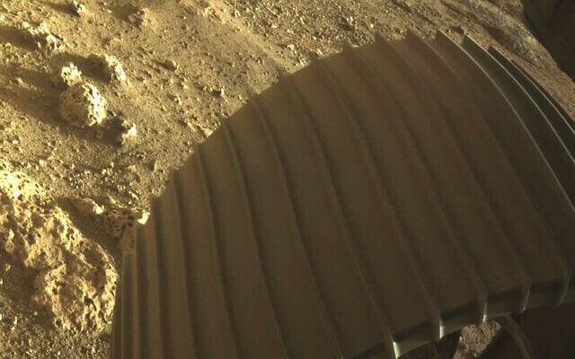 This photo provided by NASA shows one of the six wheels on the Perseverance Mars rover, which landed on Thursday, Feb. 18, 2021. (NASA/JPL-Caltech via AP) This photo provided by NASA shows one of the six wheels on the Perseverance Mars rover, which landed on Thursday, Feb. 18, 2021. (NASA/JPL-Caltech via AP)