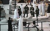 A military delegation visit the display of  Halcon, a regional leader in the end-to-end manufacturing of precision-guided systems, during the opening day of the International Defence Exhibition and Conference, IDEX, in Abu Dhabi, United Arab Emirates, February 21, 2021. (Kamran Jebreili/AP)