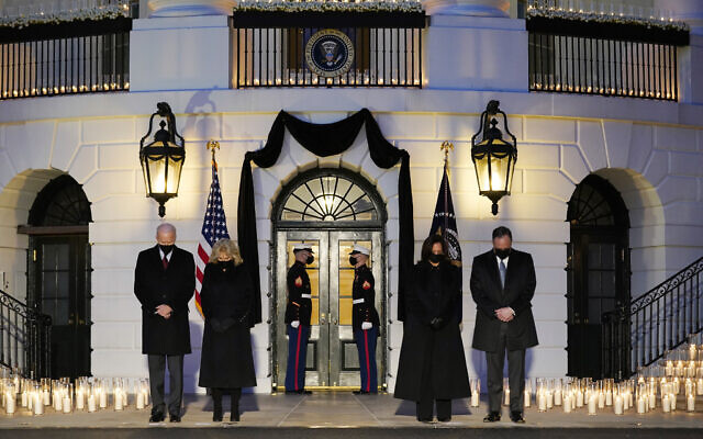 From left, President Joe Biden, First Lady Jill Biden, Vice President Kamala Harris and her husband Doug Emhoff, bow their heads during a ceremony to honor the 500,000 Americans that died from COVID-19, at the White House, Monday, Feb. 22, 2021, in Washington. (AP Photo/Evan Vucci) From left, President Joe Biden, First Lady Jill Biden, Vice President Kamala Harris and her husband Doug Emhoff, bow their heads during a ceremony to honor the 500,000 Americans that died from COVID-19, at the White House, Monday, Feb. 22, 2021, in Washington. (AP Photo/Evan Vucci)