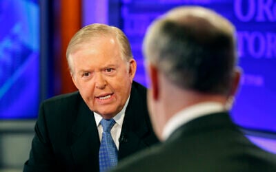 Lou Dobbs, left, speaks with Bill O'Reilly during taping a segment for Fox News channel's "The O'Reilly Factor," in New York, November 16, 2009.  (AP/Kathy Willens)