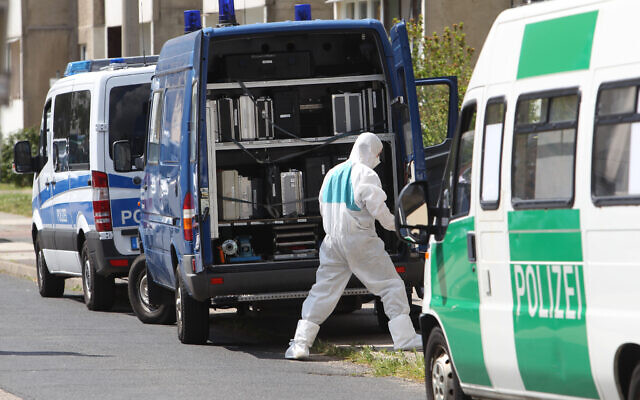llustrative: Forensic policemen search for evidence in the German town of Dessau-Rosslau, May 13, 2016. (Sebastian Willnow/dpa via AP,file) llustrative: Forensic policemen search for evidence in the German town of Dessau-Rosslau, May 13, 2016. (Sebastian Willnow/dpa via AP,file)