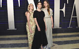 Alana Haim, from left, Danielle Haim and Este Haim arrive at the Vanity Fair Oscar Party on Feb. 24, 2019, in Beverly Hills, California (Evan Agostini/Invision/AP)