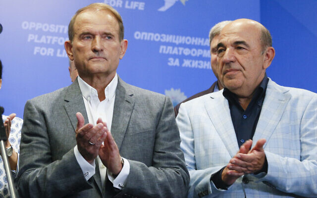 Ukrainian tycoons and one of the leaders of the 'Opposition Platform-For Life' political party Viktor Medvedchuk, left, and Vadim Rabinovich applaud while speaking at their headquarters after the parliamentary election in Kiev, Ukraine, Sunday, July 21, 2019. (AP Photo/Efrem Lukatsky) Ukrainian tycoons and one of the leaders of the 'Opposition Platform-For Life' political party Viktor Medvedchuk, left, and Vadim Rabinovich applaud while speaking at their headquarters after the parliamentary election in Kiev, Ukraine, Sunday, July 21, 2019. (AP Photo/Efrem Lukatsky)
