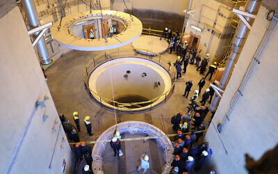 Technicians work at the Arak heavy water reactor's secondary circuit, as officials and media visit the site, near Arak, 150 miles (250 kilometers) southwest of the capital Tehran, Iran, Monday, Dec. 23, 2019. (Atomic Energy Organization of Iran via AP)