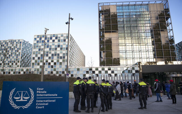 Police escort a group of supporters of former Ivory Coast president Laurent Gbagbo outside the International Criminal Court in The Hague, Netherlands, Thursday, February 6, 2020. (AP/Peter Dejong) Police escort a group of supporters of former Ivory Coast president Laurent Gbagbo outside the International Criminal Court in The Hague, Netherlands, Thursday, February 6, 2020. (AP/Peter Dejong)