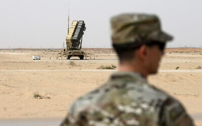A member of the US Air Force stands near a Patriot missile battery at the Prince Sultan air base in al-Kharj, central Saudi Arabia, February 20, 2020. (Andrew Caballero-Reynolds/Pool via AP)