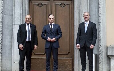 File: German Foreign Minister Heiko Maas, center, welcomes the Foreign Minister of Great Britain, Dominic Raab, right, and the Foreign Minister of France, Jean-Yves Le Drian, left, for a meeting in Berlin, Germany, Friday, June 19, 2020. (Bernd von Jutrczenka/DPA via AP, Pool) File: German Foreign Minister Heiko Maas, center, welcomes the Foreign Minister of Great Britain, Dominic Raab, right, and the Foreign Minister of France, Jean-Yves Le Drian, left, for a meeting in Berlin, Germany, Friday, June 19, 2020. (Bernd von Jutrczenka/DPA via AP, Pool)