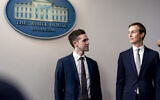 Avi Berkowitz, assistant to the president and special representative for international negotiations, left, and president Donald Trump's White House senior adviser Jared Kushner, look at each other during a press briefing in the James Brady Press Briefing Room at the White House in Washington, August 13, 2020 (AP Photo/Andrew Harnik)