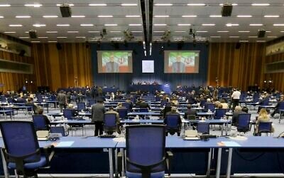 File: The head of Iran's Atomic Energy Organization Ali Akbar Salehi is seen on a giant video screen during his online broadcasted speech during the general conference of the IAEA, in Vienna, Austria, Monday, Sept. 21, 2020. (AP Photo/Ronald Zak)