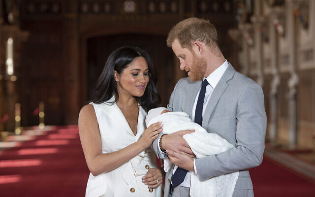 Britain's Prince Harry and Meghan, Duchess of Sussex, pose during a photocall with their then-newborn son Archie, in St George's Hall at Windsor Castle, Windsor, south England, on May 8, 2019. (Dominic Lipinski/ Pool via AP) Britain's Prince Harry and Meghan, Duchess of Sussex, pose during a photocall with their then-newborn son Archie, in St George's Hall at Windsor Castle, Windsor, south England, on May 8, 2019. (Dominic Lipinski/ Pool via AP)