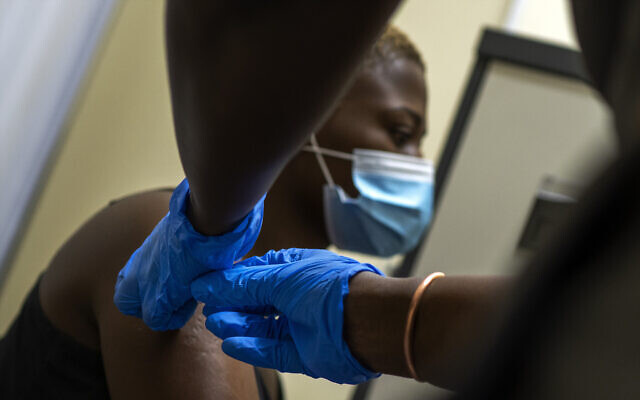 Illustrative -- Thabisle Khlatshwayo, receives her second shot at a vaccine trial facility for AstraZeneca at Soweto's Chris Sani Baragwanath Hospital outside Johannesburg, South Africa, Nov. 30, 2020 (AP Photo/Jerome Delay) Illustrative -- Thabisle Khlatshwayo, receives her second shot at a vaccine trial facility for AstraZeneca at Soweto's Chris Sani Baragwanath Hospital outside Johannesburg, South Africa, Nov. 30, 2020 (AP Photo/Jerome Delay)