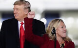 Rep. Marjorie Taylor Greene, R-Ga., speaks as President Donald Trump listens at a campaign rally in support of Senate candidates Sen. Kelly Loeffler, R-Ga., and David Perdue in Dalton, Georgia, Monday, January 4, 2021. (AP Photo/Brynn Anderson)