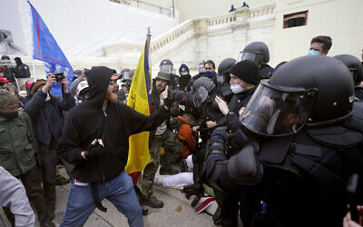 Trump supporters try to break through a police barrier, Jan. 6, 2021, at the Capitol in Washington (AP Photo/Julio Cortez)