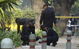National Security Guard soldiers inspect the site of a blast near the Israeli Embassy in New Delhi, India, on January 30, 2021. (Dinesh Joshi/AP)