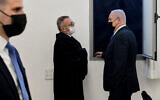 Prime Minister Benjamin Netanyahu, right, speaks with his lawyers prior to a hearing at the district court in Jerusalem, February 8, 2021. (Reuven Castro/AP)