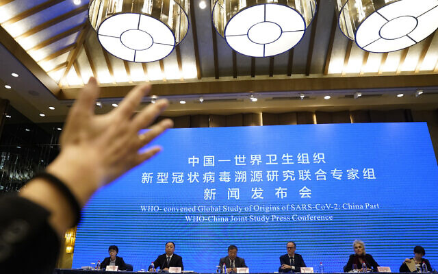A journalist raises her hand to ask a question at the WHO-China Joint Study Press Conference held at the end of the World Health Organization mission in Wuhan, China, Tuesday, Feb. 9, 2021. (AP Photo/Ng Han Guan) A journalist raises her hand to ask a question at the WHO-China Joint Study Press Conference held at the end of the World Health Organization mission in Wuhan, China, Tuesday, Feb. 9, 2021. (AP Photo/Ng Han Guan)