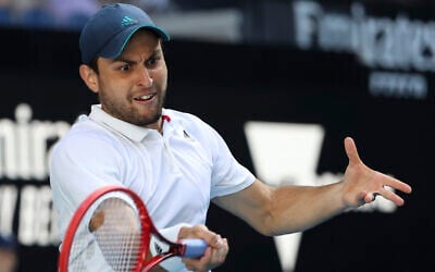 Russian-Israeli Aslan Karatsev makes a forehand return to Argentina's Diego Schwartzman during their third round match at the Australian Open tennis championship in Melbourne, Australia,  February 12, 2021.(Hamish Blair/AP)