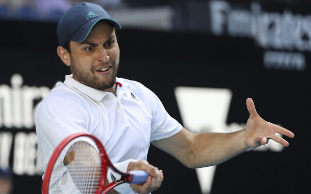 Russian-Israeli Aslan Karatsev makes a forehand return to Argentina's Diego Schwartzman during their third round match at the Australian Open tennis championship in Melbourne, Australia, February 12, 2021.(Hamish Blair/AP) Russian-Israeli Aslan Karatsev makes a forehand return to Argentina's Diego Schwartzman during their third round match at the Australian Open tennis championship in Melbourne, Australia, February 12, 2021.(Hamish Blair/AP)