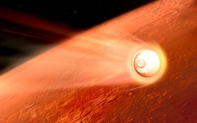 In this illustration made available by NASA, the spacecraft containing the Perseverance rover slows down using the drag generated by traveling through the Martian atmosphere. (NASA/JPL-Caltech via AP) In this illustration made available by NASA, the spacecraft containing the Perseverance rover slows down using the drag generated by traveling through the Martian atmosphere. (NASA/JPL-Caltech via AP)