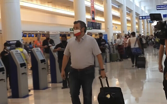In this screengrab, Senator Ted Cruz, walks to check in for his flight back to the US, at Cancun International Airport in Cancun, Mexico, Febuary 18, 2021. (AP/Dan Christian Rojas) In this screengrab, Senator Ted Cruz, walks to check in for his flight back to the US, at Cancun International Airport in Cancun, Mexico, Febuary 18, 2021. (AP/Dan Christian Rojas)