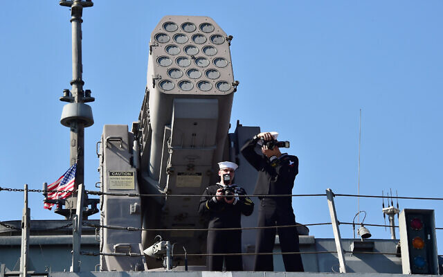 Illustrative: US crew members, standing in front of the RIM-116 Rolling Airframe Missile (RAM) launcher on the deck of the USS Fort Worth (LCS 3) in the southeastern port city of Busan, March 14, 2015. (Jung Yeon-je/AP) Illustrative: US crew members, standing in front of the RIM-116 Rolling Airframe Missile (RAM) launcher on the deck of the USS Fort Worth (LCS 3) in the southeastern port city of Busan, March 14, 2015. (Jung Yeon-je/AP)