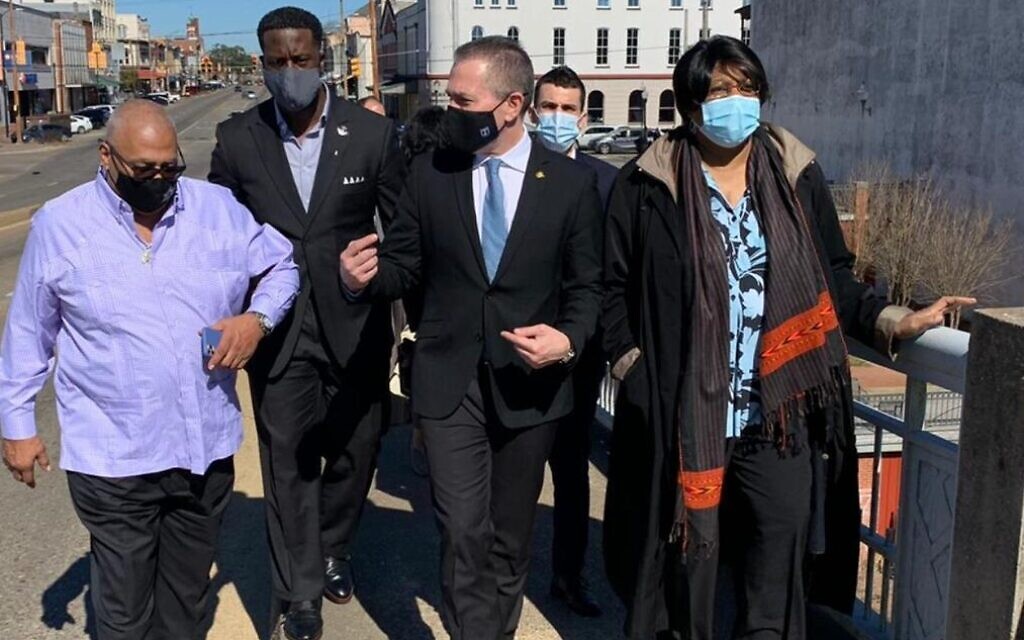 Israel's Ambassador to the US Gilad Erdan (center) at the Edmund Pettus Bridge in Selma, Alabama with leaders of the African American community there; February 22, 2021. (Israeli Embassy in Washington) Israel's Ambassador to the US Gilad Erdan (center) at the Edmund Pettus Bridge in Selma, Alabama with leaders of the African American community there; February 22, 2021. (Israeli Embassy in Washington)
