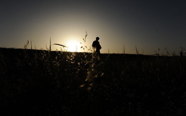 An IDF soldier seen silhouetted as he is walking through the fields near his army base, in Beersheba, southern Israel, March 31, 2014 (Mendy Hechtman/FLASH90) An IDF soldier seen silhouetted as he is walking through the fields near his army base, in Beersheba, southern Israel, March 31, 2014 (Mendy Hechtman/FLASH90)