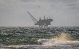 View of the Israeli Leviathan gas field gas processing rig as seen from Dor Habonim Beach Nature Reserve, on January 1, 2020. (Flash90)
