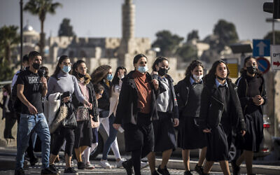 Israelis walk in Jerusalem on February 15, 2021. (Olivier Fitoussi/Flash90)