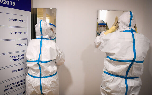 Illustrative: A medical team at a coronavirus ward of the Sheba Medical Center, in Ramat Gan, July 27, 2020. (Yossi Zeliger/Flash90) Illustrative: A medical team at a coronavirus ward of the Sheba Medical Center, in Ramat Gan, July 27, 2020. (Yossi Zeliger/Flash90)