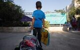 A first-grade student on his first day of school at Tali Geulim school in Jerusalem, on September 1, 2020. (Noam Revkin Fenton/Flash90)