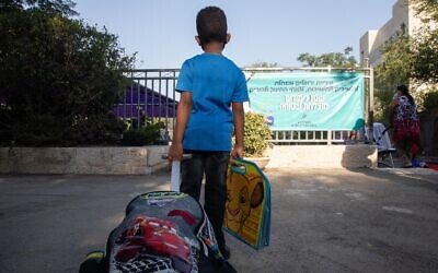 A first-grade student on his first day of school at Tali Geulim school in Jerusalem, on September 1, 2020. (Noam Revkin Fenton/Flash90)
