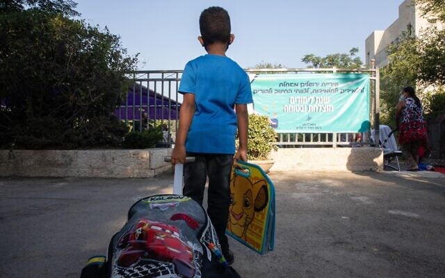 A first-grade student on his first day of school at Tali Geulim school in Jerusalem, on September 1, 2020. (Noam Revkin Fenton/Flash90) A first-grade student on his first day of school at Tali Geulim school in Jerusalem, on September 1, 2020. (Noam Revkin Fenton/Flash90)