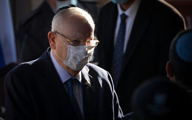 Illustrative: President Reuven Rivlin, attends a funeral at Givat Shaul cemetery in Jerusalem, on December 31, 2020. (Yonatan Sindel/Flash90) Illustrative: President Reuven Rivlin, attends a funeral at Givat Shaul cemetery in Jerusalem, on December 31, 2020. (Yonatan Sindel/Flash90)