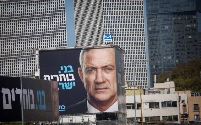 An election poster showing Blue and White party Benny Gantz, posted alongside the Ayalon highway in Tel Aviv, February 1, 2021. (Miriam Alster/FLASH90) An election poster showing Blue and White party Benny Gantz, posted alongside the Ayalon highway in Tel Aviv, February 1, 2021. (Miriam Alster/FLASH90)