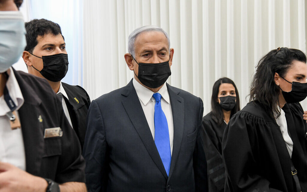 Prime Minister Benjamin Netanyahu arrives for a court hearing at the District Court in Jerusalem on February 8, 2021. Netanyahu is charged with fraud and breach of trust in three cases and bribery in one of them. (Reuven Kastro/POOL) Prime Minister Benjamin Netanyahu arrives for a court hearing at the District Court in Jerusalem on February 8, 2021. Netanyahu is charged with fraud and breach of trust in three cases and bribery in one of them. (Reuven Kastro/POOL)