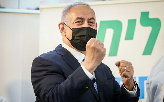 Former prime minister Benjamin Netanyahu during a visit at a Covid-19 vaccination center in Zarzir, northern Israel, February 9, 2021. (David Cohen/Flash90) Former prime minister Benjamin Netanyahu during a visit at a Covid-19 vaccination center in Zarzir, northern Israel, February 9, 2021. (David Cohen/Flash90)