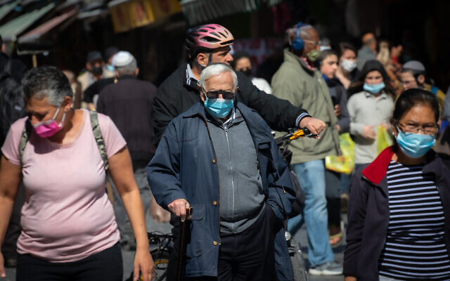 Jerusalemites shop at the Mahane Yehuda Market on February 9, 2021, as Israel exits its third lockdown due to the COVID-19 pandemic. (Olivier Fitoussi/Flash90) Jerusalemites shop at the Mahane Yehuda Market on February 9, 2021, as Israel exits its third lockdown due to the COVID-19 pandemic. (Olivier Fitoussi/Flash90)