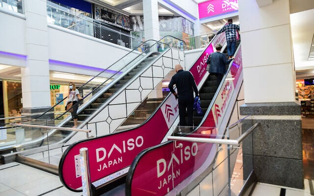 People shop at a mall in the city of Bat Yam which was partially opened against government regulations, on February 11, 2021 (Avshalom Sassoni/Flash90) People shop at a mall in the city of Bat Yam which was partially opened against government regulations, on February 11, 2021 (Avshalom Sassoni/Flash90)