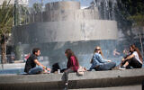 Israelis sit in Dizengoff Square in Tel Aviv on February 15, 2021. (Miriam Alster/Flash90)