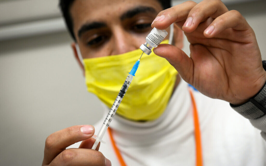 A medic prepares a vaccine at Meuhedet COVID-19 vaccination center in Kfar Habad, central Israel, on February 16, 2021. (Flash90)