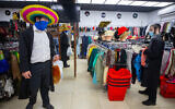 Jewish ultra-Orthodox young men search for costumes ahead the holiday of Purim in the city center of Jerusalem on February 22, 2021. (Olivier Fitoussi/Flash90)