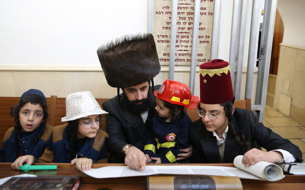 Ultra-Orthodox Jews read Megillat Esther during the Jewish holiday of Purim, in the northern town of Meron, on February 25, 2021. (David Cohen/Flash90) Ultra-Orthodox Jews read Megillat Esther during the Jewish holiday of Purim, in the northern town of Meron, on February 25, 2021. (David Cohen/Flash90)