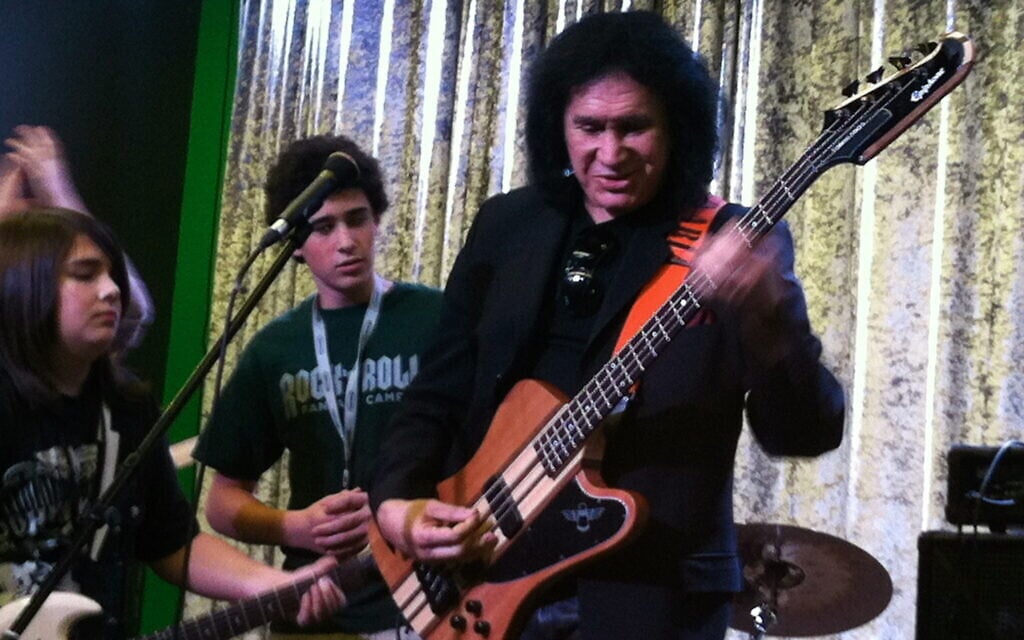 KISS founding member Gene Simmons rocks out with campers at Rock N' Roll Fantasy Camp in this undated photo. (Courtesy Bruce Kulick)
