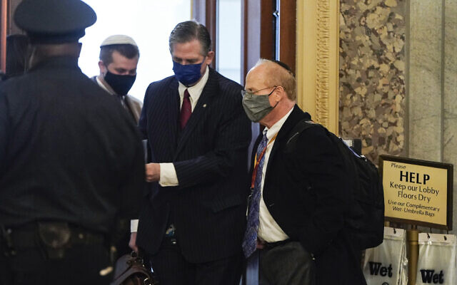 David Schoen, right, arrives prior to the start of opening arguments on the second day of Donald Trump's second impeachment trial, at the US Capitol, February 10, 2021. (Joshua Roberts/Pool/Getty Images via JTA) David Schoen, right, arrives prior to the start of opening arguments on the second day of Donald Trump's second impeachment trial, at the US Capitol, February 10, 2021. (Joshua Roberts/Pool/Getty Images via JTA)