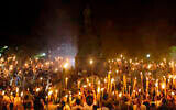 Neo-Nazis and white supremacists encircle counter-protesters at the base of a statue of Thomas Jefferson after marching through the University of Virginia campus with torches in Charlottesville, Va., August 11, 2017. (Shay Horse/NurPhoto via Getty Images)