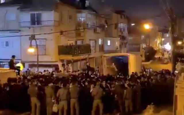 Hundreds pack a street in Bnei Brak for the funeral of Rabbi Chaim Meir Wosner on February 7, 2021. (Screen capture/ Twitter) Hundreds pack a street in Bnei Brak for the funeral of Rabbi Chaim Meir Wosner on February 7, 2021. (Screen capture/ Twitter)